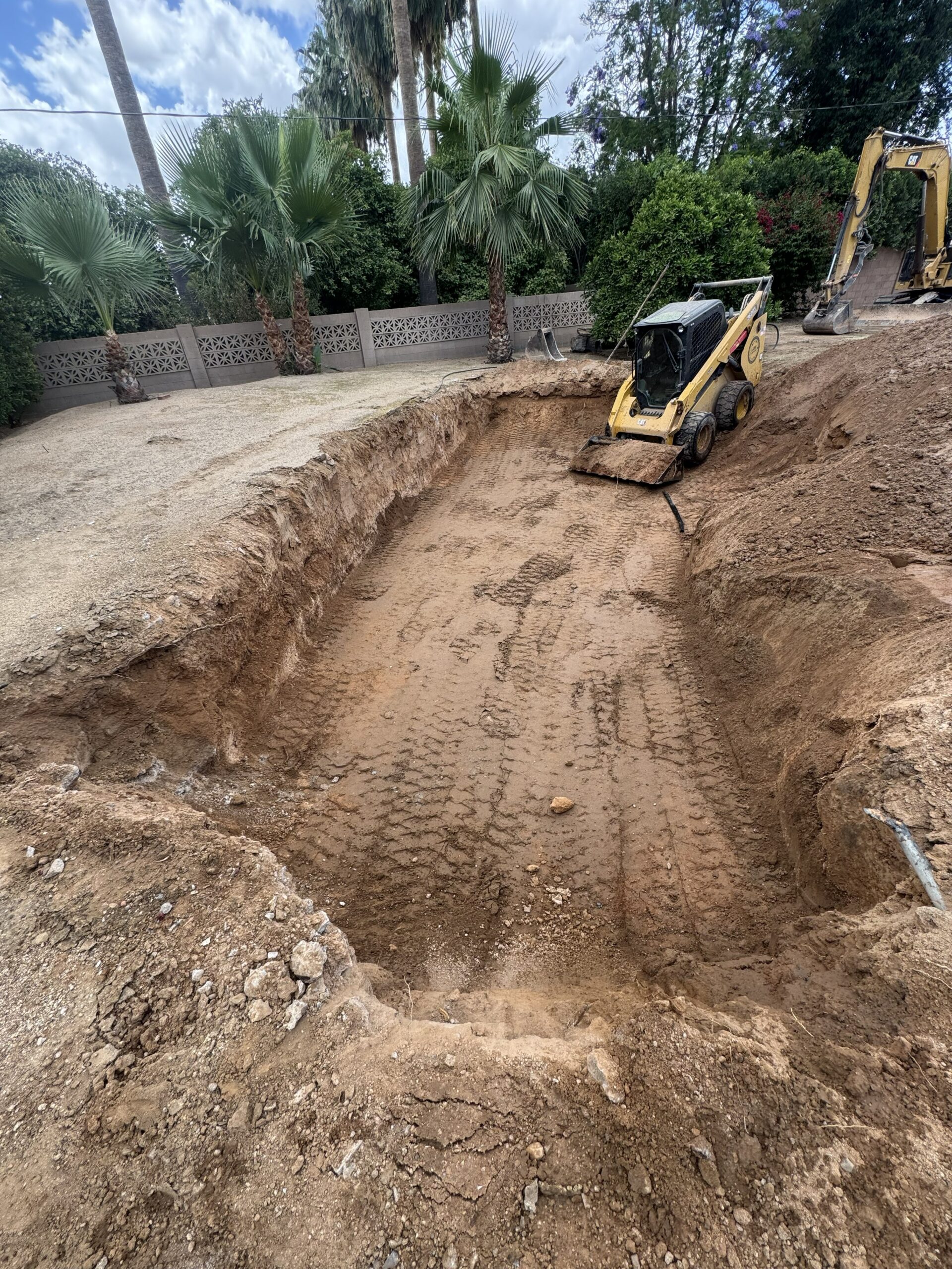 Demolition contractor performing swimming pool removal services for a residential property in Mesa and the East Valley.
